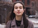 Marika Monarque standing on a street in winter.